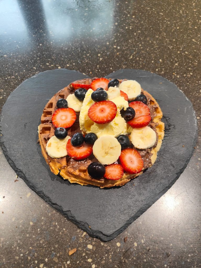 Loaded waffle with fresh fruit and chocolate
