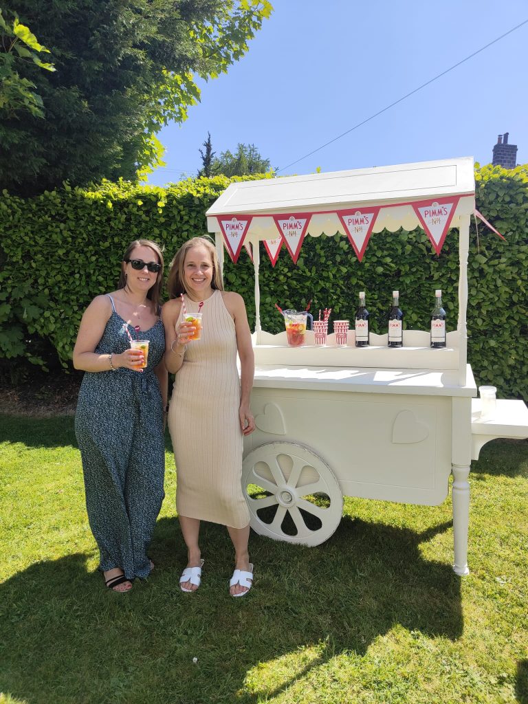 Guests enjoying drinks from the Pimms cart
