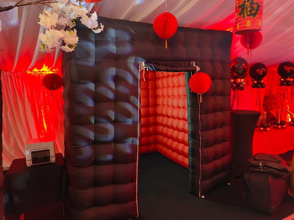 Black inflatable photo booth with LED lighting