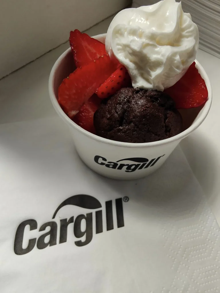 Strawberries and cream in branded tubs