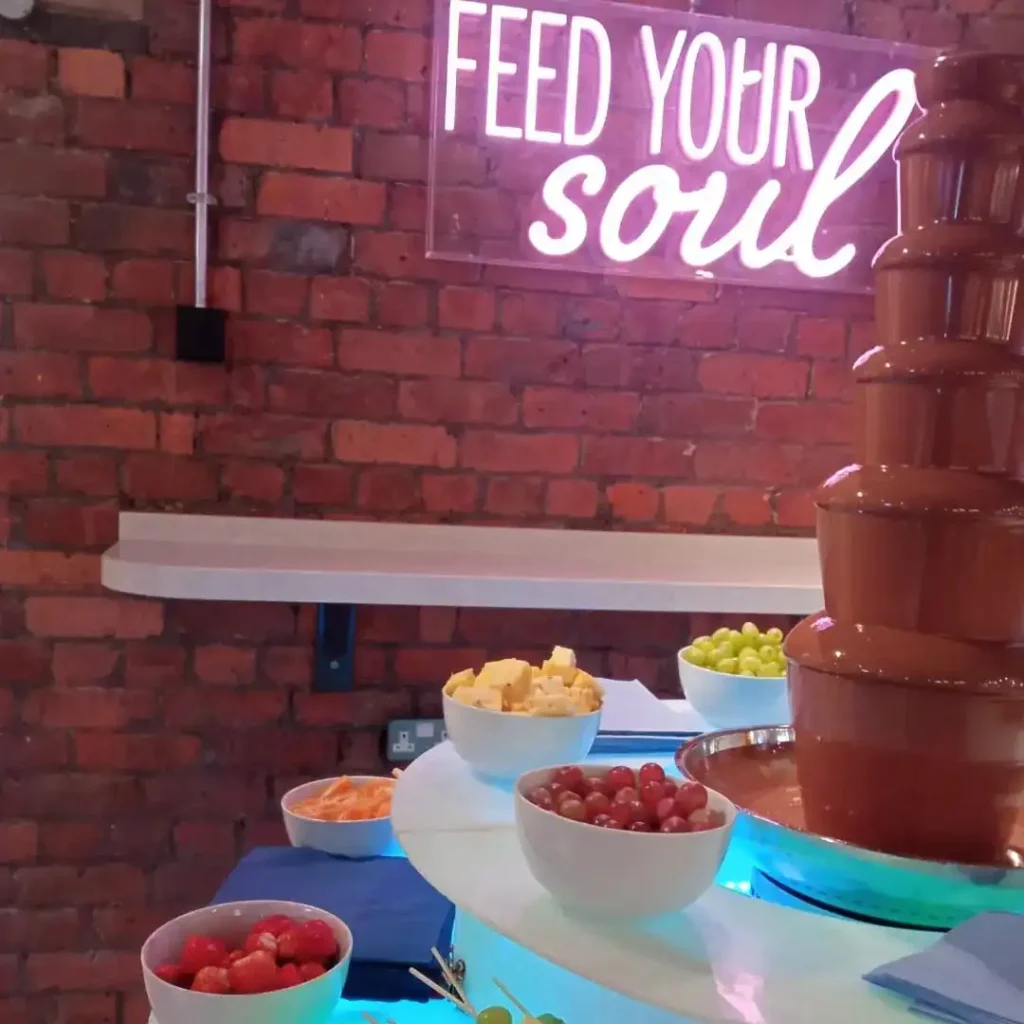 Chocolate fountain hire with pink neon sign