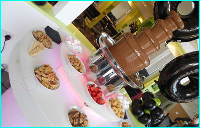 Dips arranged around a chocolate fountain