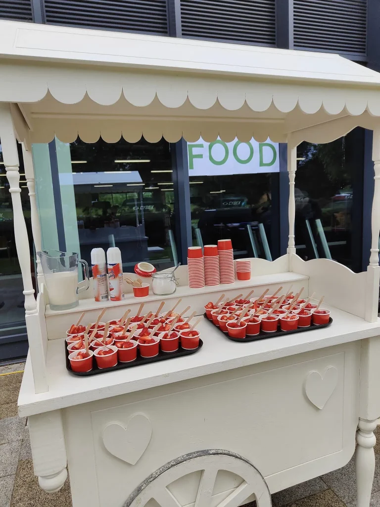 Strawberry and cream cart serving at an event